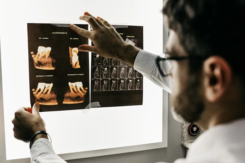 Dental hygienist with patient in office